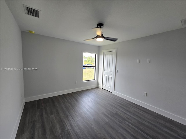 1605 W 11th St, Lehigh Acres, FL 33971 - empty room featuring dark wood-style flooring and a ceiling fan
