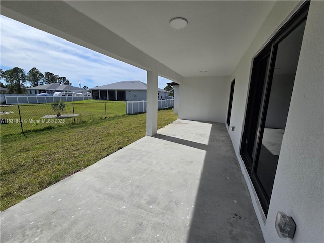 1605 W 11th St, Lehigh Acres, FL 33971 - view of patio / terrace featuring a residential view