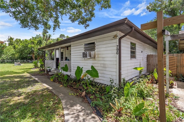 796 29th Ave, Vero Beach, FL 32968 - view of property exterior featuring a porch and cooling unit