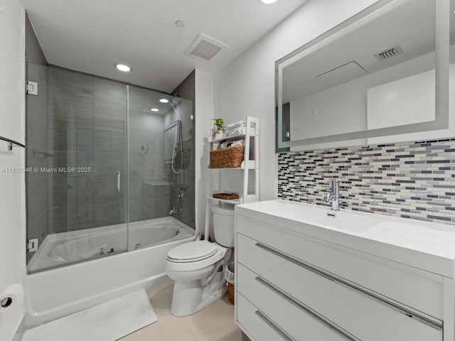 950 Brickell Bay Dr Unit 1103, Miami, FL 33131 - full bath featuring combined bath / shower with glass door, vanity, tile patterned floors, tasteful backsplash, and recessed lighting