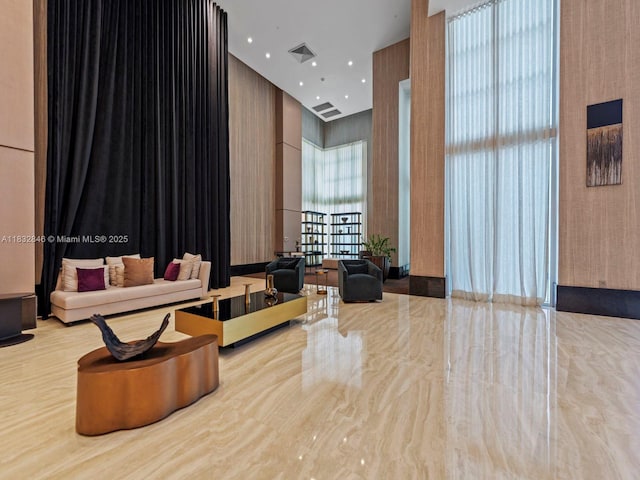 950 Brickell Bay Dr Unit 1103, Miami, FL 33131 - lobby with a towering ceiling and wallpapered walls