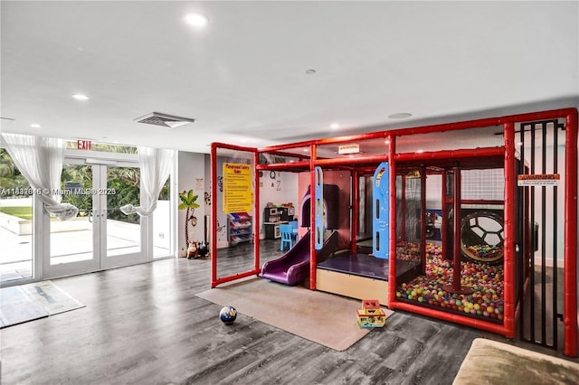 950 Brickell Bay Dr Unit 1103, Miami, FL 33131 - exercise room with french doors, wood finished floors, and recessed lighting