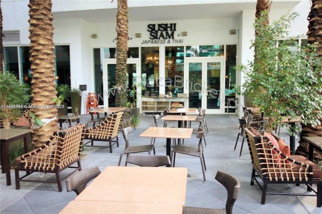 950 Brickell Bay Dr Unit 1103, Miami, FL 33131 - view of patio / terrace with french doors and outdoor dining space