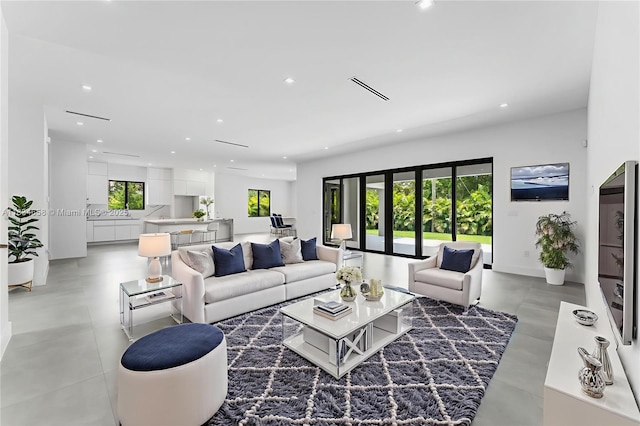 8220 SW 193rd Ter, Cutler Bay, FL 33157 - living area featuring recessed lighting and finished concrete floors
