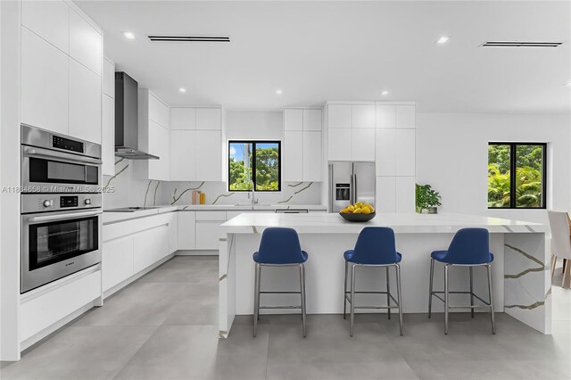 8220 SW 193rd Ter, Cutler Bay, FL 33157 - kitchen with stainless steel appliances, wall chimney exhaust hood, modern cabinets, and recessed lighting