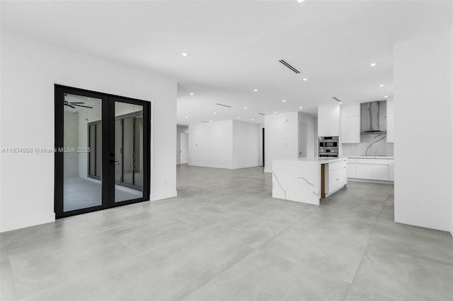 8220 SW 193rd Ter, Cutler Bay, FL 33157 - unfurnished living room featuring concrete floors and recessed lighting