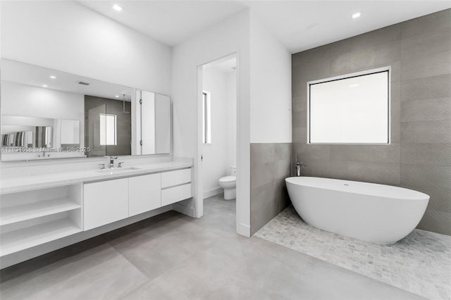 8220 SW 193rd Ter, Cutler Bay, FL 33157 - bathroom featuring vanity, a soaking tub, concrete floors, and recessed lighting