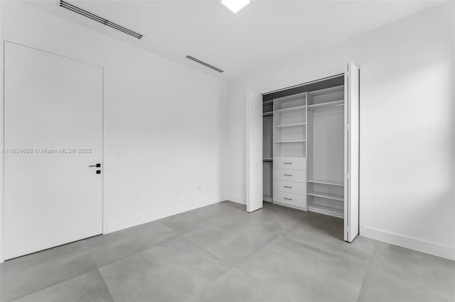 8220 SW 193rd Ter, Cutler Bay, FL 33157 - unfurnished bedroom with concrete floors and a closet