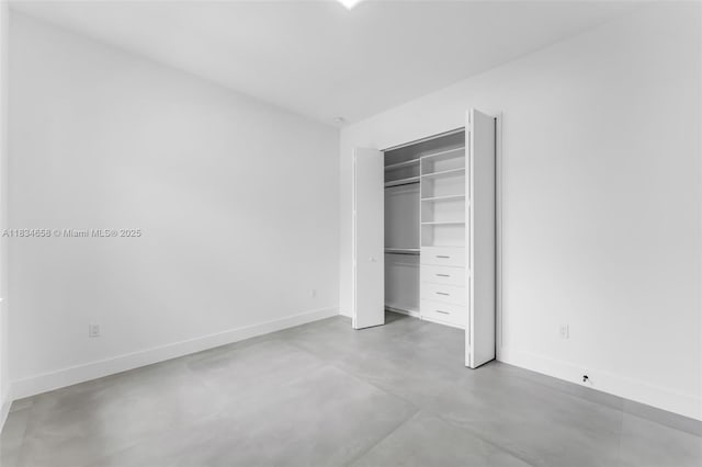 8220 SW 193rd Ter, Cutler Bay, FL 33157 - unfurnished bedroom with concrete flooring and a closet