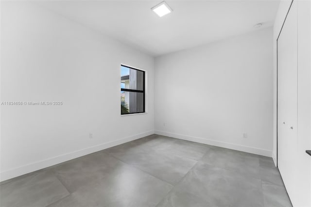 8220 SW 193rd Ter, Cutler Bay, FL 33157 - spare room with finished concrete floors and a smoke detector