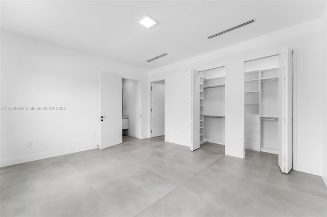 8220 SW 193rd Ter, Cutler Bay, FL 33157 - unfurnished bedroom featuring multiple closets and finished concrete floors