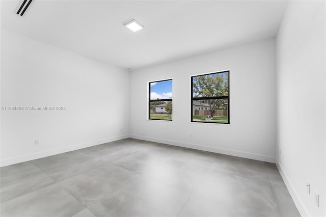 8220 SW 193rd Ter, Cutler Bay, FL 33157 - spare room with finished concrete flooring and baseboards