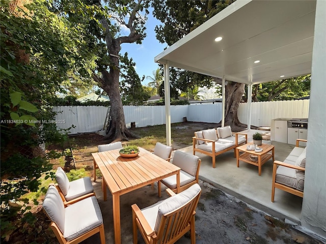 1812 NW 64th St, Miami, FL 33147 - fenced backyard with an outdoor living space, a patio area, and outdoor dining area