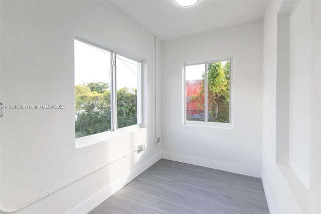 1812 NW 64th St, Miami, FL 33147 - empty room with wood finished floors and baseboards