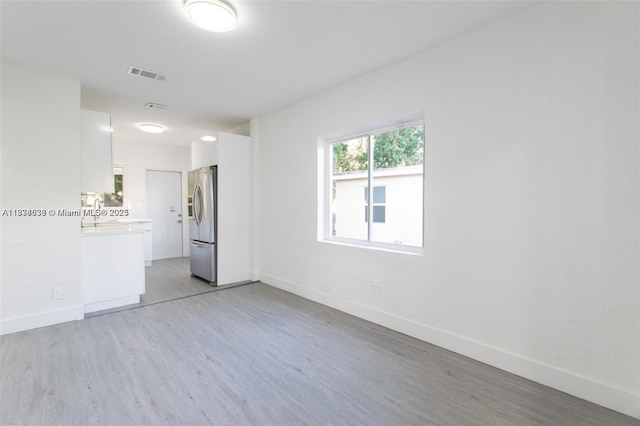 1812 NW 64th St, Miami, FL 33147 - unfurnished room with light wood-type flooring