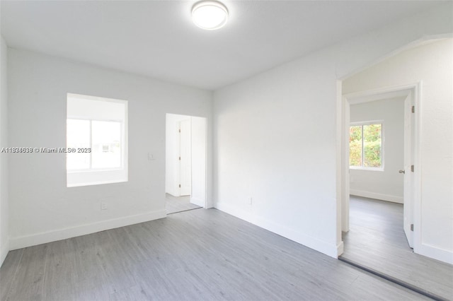 1812 NW 64th St, Miami, FL 33147 - unfurnished room with wood finished floors and baseboards