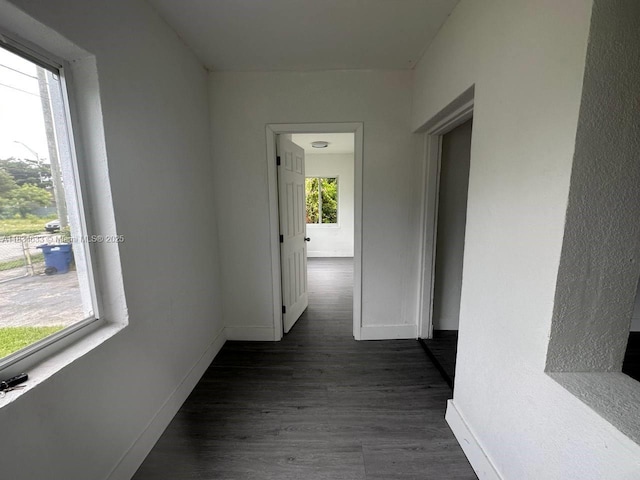1812 NW 64th St, Miami, FL 33147 - corridor featuring baseboards and dark wood-style flooring
