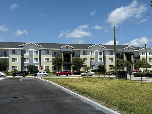 1812 NW 64th St, Miami, FL 33147 - view of building exterior featuring uncovered parking and a residential view