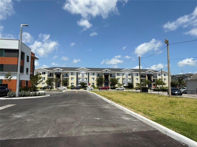 1812 NW 64th St, Miami, FL 33147 - view of property featuring a residential view and uncovered parking