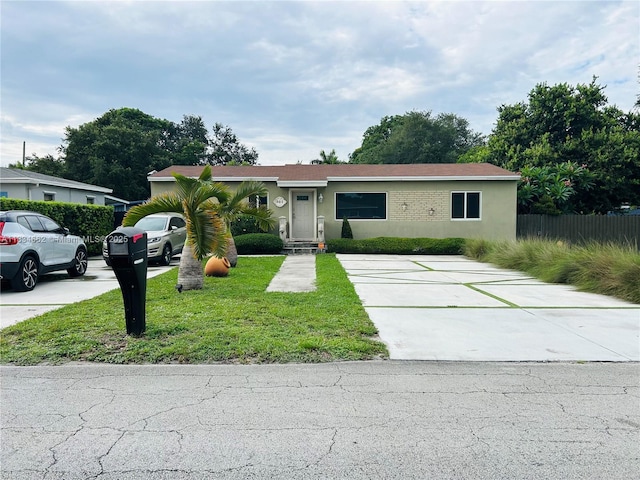 301 NW 146th St, Miami, FL 33168 - view of front facade featuring concrete driveway and stucco siding