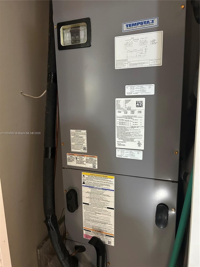 301 NW 146th St, Miami, FL 33168 - utility room with heating unit