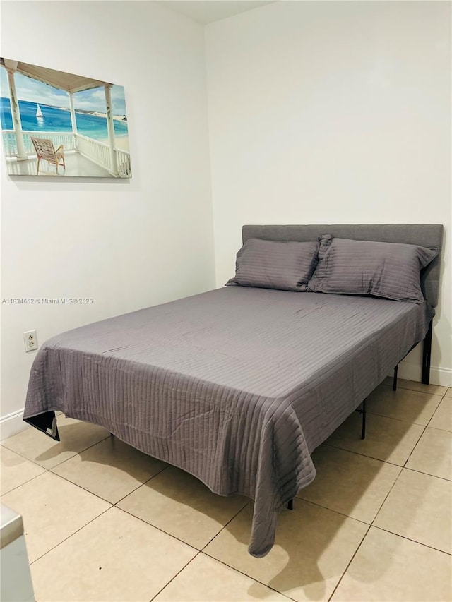 301 NW 146th St, Miami, FL 33168 - bedroom featuring tile patterned flooring and baseboards
