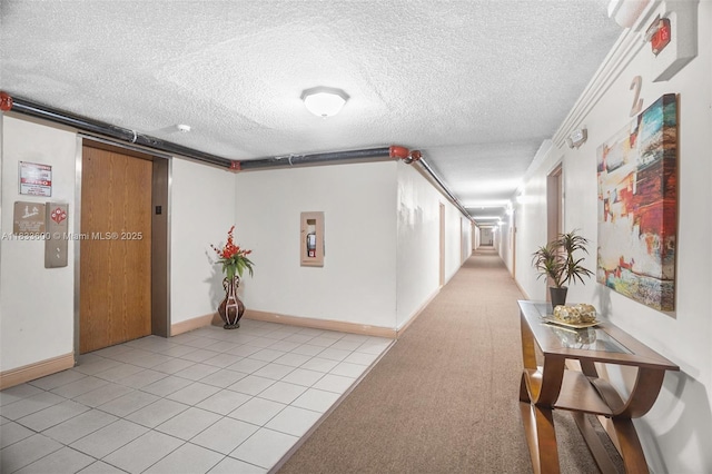 9310 Fontainebleau Blvd Unit 203, Miami, FL 33172 - hallway with a textured ceiling and light tile patterned flooring