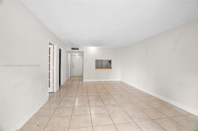 9310 Fontainebleau Blvd Unit 203, Miami, FL 33172 - spare room with light tile patterned floors and a textured ceiling