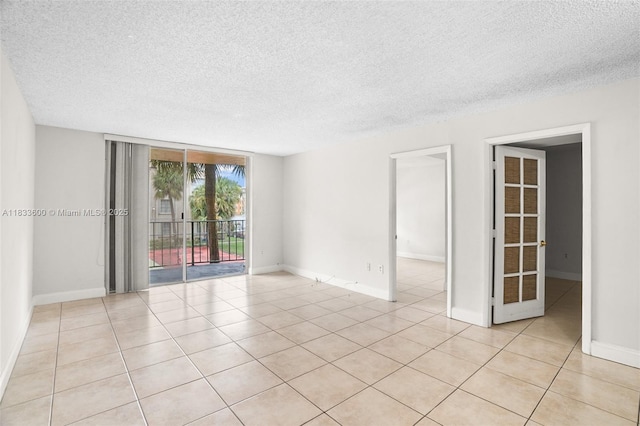 9310 Fontainebleau Blvd Unit 203, Miami, FL 33172 - unfurnished room with a textured ceiling and light tile patterned flooring
