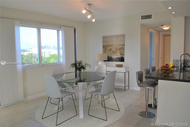 816 NW 11th St Unit 801, Miami, FL 33136 - dining area with light tile patterned flooring and baseboards