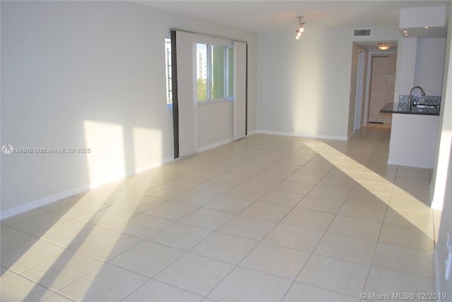 816 NW 11th St Unit 801, Miami, FL 33136 - empty room featuring light tile patterned flooring and baseboards