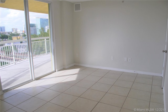 816 NW 11th St Unit 801, Miami, FL 33136 - spare room featuring a city view and light tile patterned flooring