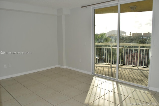 816 NW 11th St Unit 801, Miami, FL 33136 - spare room with tile patterned floors and baseboards