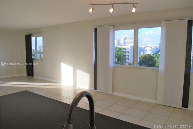 816 NW 11th St Unit 801, Miami, FL 33136 - tiled spare room with baseboards