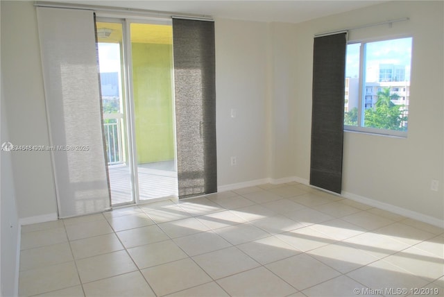816 NW 11th St Unit 801, Miami, FL 33136 - spare room featuring tile patterned flooring and baseboards