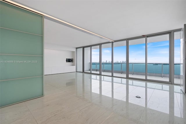 1331 Brickell Bay Dr Unit 2705, Miami, FL 33131 - empty room with a water view and a wall of windows