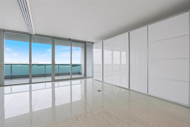 1331 Brickell Bay Dr Unit 2705, Miami, FL 33131 - spare room with a wall of windows