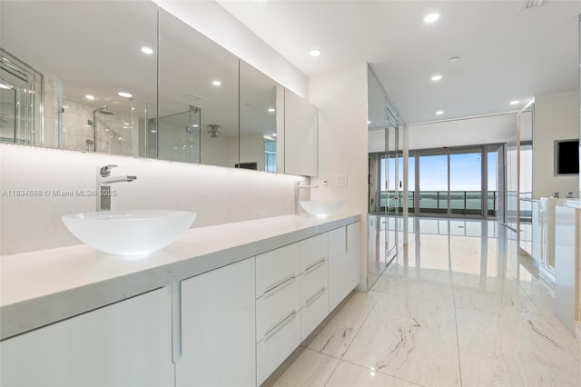 1331 Brickell Bay Dr Unit 2705, Miami, FL 33131 - full bath featuring double vanity, a shower with shower door, recessed lighting, and marble tiled floors