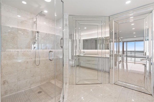 1331 Brickell Bay Dr Unit 2705, Miami, FL 33131 - bathroom with a stall shower, recessed lighting, marble finish flooring, and vanity
