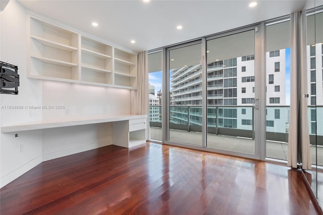 1331 Brickell Bay Dr Unit 2705, Miami, FL 33131 - spare room featuring expansive windows, wood finished floors, recessed lighting, and built in features