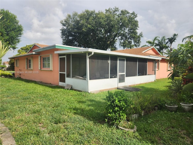 6900 NW 94th Ave, Tamarac, FL 33321 - back of property featuring a sunroom and a yard