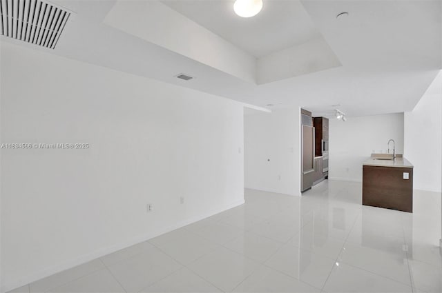 465 Brickell Ave Unit 4505, Miami, FL 33131 - empty room with light tile patterned floors and a raised ceiling