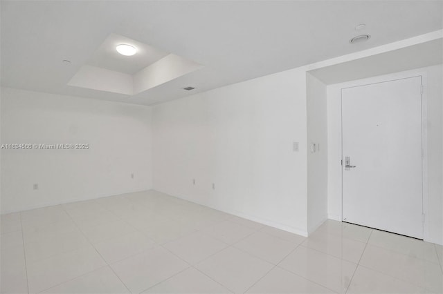 465 Brickell Ave Unit 4505, Miami, FL 33131 - unfurnished room with a tray ceiling and light tile patterned floors