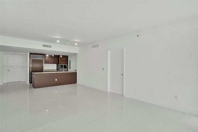 465 Brickell Ave Unit 4505, Miami, FL 33131 - unfurnished living room featuring light tile patterned floors and rail lighting
