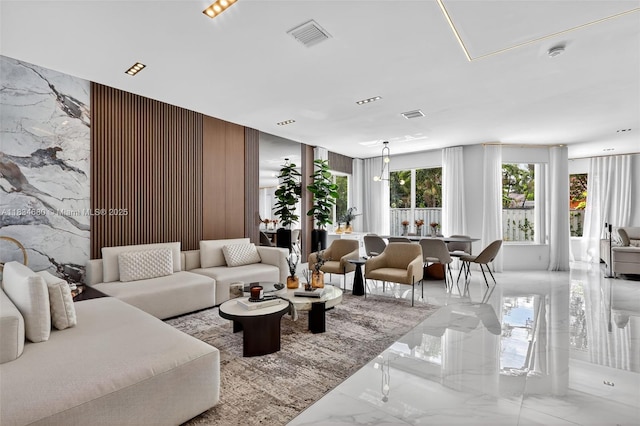 2036 SW 159th Ave, Miramar, FL 33027 - living room featuring marble tiled floors and stone wall