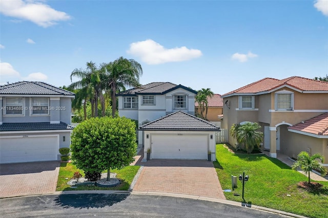 2036 SW 159th Ave, Miramar, FL 33027 - view of front of property with a garage, decorative driveway, stucco siding, and a front lawn