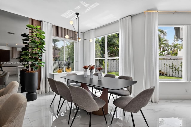 2036 SW 159th Ave, Miramar, FL 33027 - dining space with light marble finish floors and healthy amount of natural light