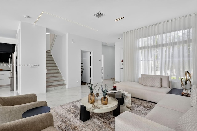 2036 SW 159th Ave, Miramar, FL 33027 - living area featuring marble look tile flooring and stairway