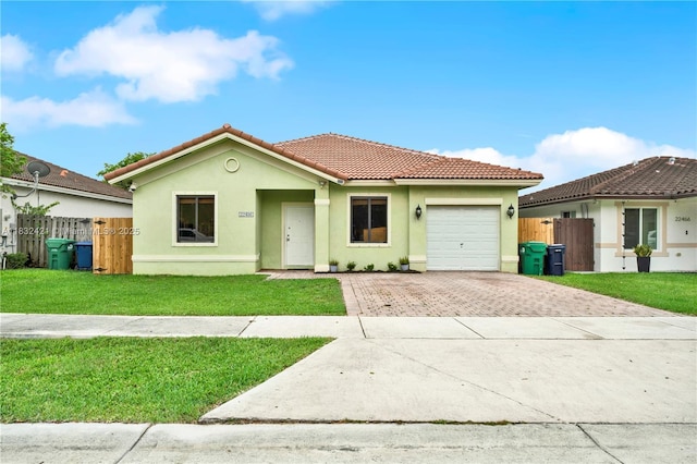 22486 SW 110th Ct, Miami, FL 33170 - view of front of house featuring decorative driveway, a tiled roof, a garage, and stucco siding