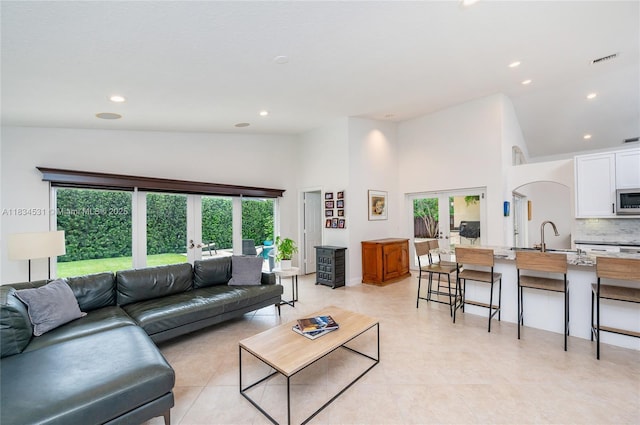 1583 SW 191st Ave, Pembroke Pines, FL 33029 - living area featuring french doors, high vaulted ceiling, and recessed lighting